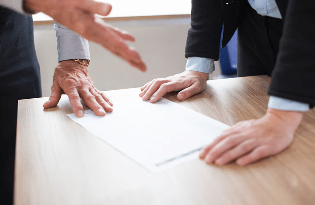 a close-up of hands on a paper