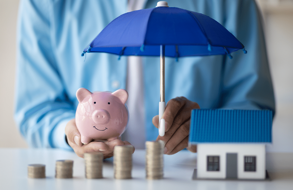 a person holding a piggy bank under a blue umbrella
